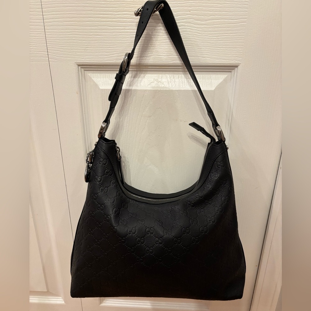 Gucci Black Embossed Leather Hobo Bag Very good condition.  Authentic.